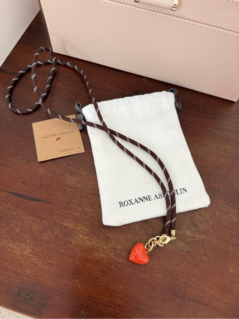 Roxanne Assoulin Brown Cord Necklace with Sienna Heart Charm and Gold Hardware